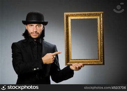 Man in topper hat and picture frame