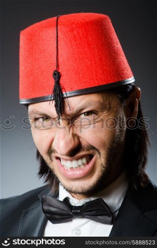 Man in traditional turkish hat and dress