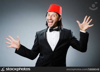 Man in traditional turkish hat and dress