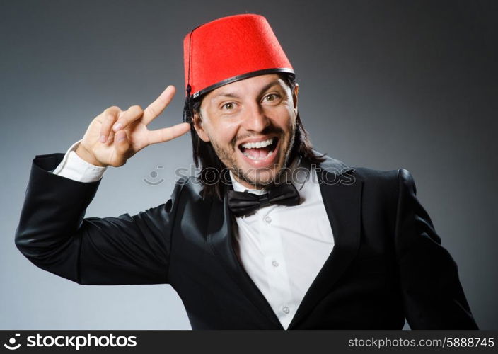 Man in traditional turkish hat and dress