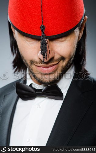 Man in traditional turkish hat and dress