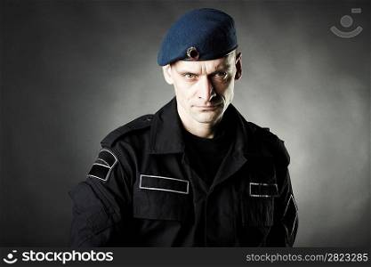 man in uniform on black background studio photo