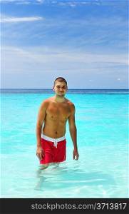 Man in water at tropical beach