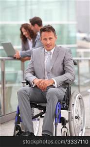 Man in wheelchair in business travel
