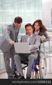 Man in wheelchair in business travel