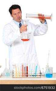 Man in white laboratory coat with test tubes