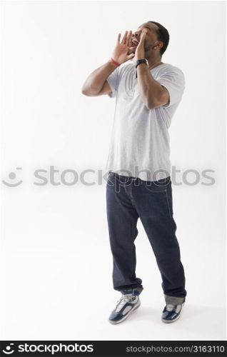 Man in white tshirt and jeans shouting