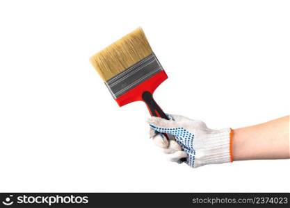 Man in white work gloves holds a new paint brush with a red handle. Hand repair tool isolated on white background. Labor day. Man in white work gloves holds new paint brush with a red handle. Hand repair tool isolated on white background.