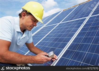 Man installing solar panels