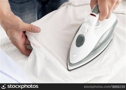 man ironing clothes close up. Resolution and high quality beautiful photo. man ironing clothes close up. High quality beautiful photo concept
