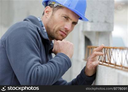 man is building a house structure