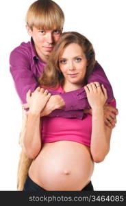 man is embracing pregnant woman against white background