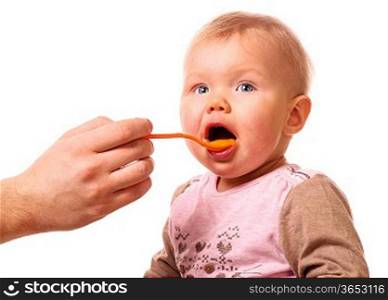 man is feeding his baby with a spoon