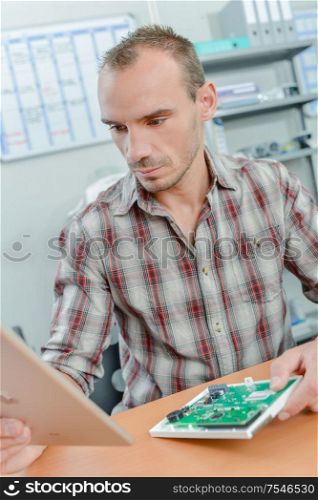 man is fixing a difficult circuit