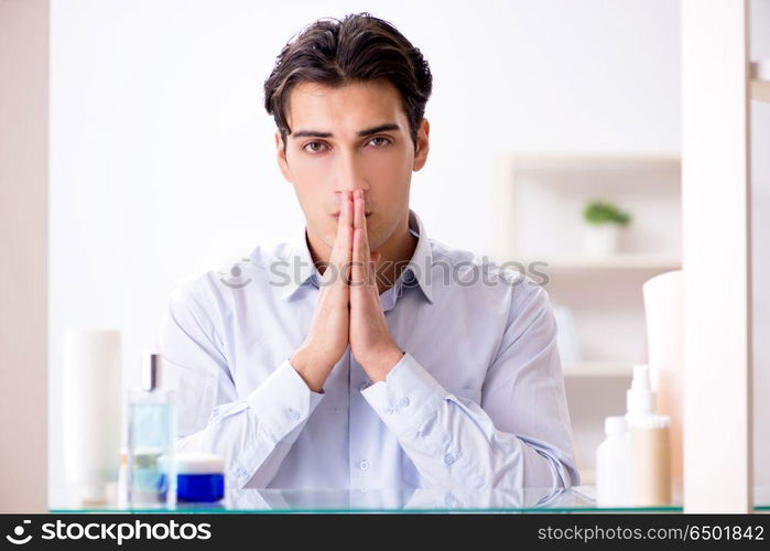 Man is getting dressed up for work in bathroom