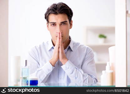 Man is getting dressed up for work in bathroom