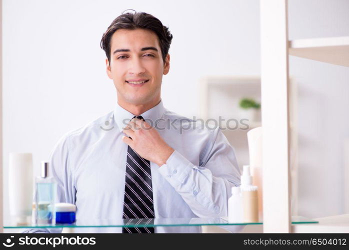 Man is getting dressed up for work in bathroom