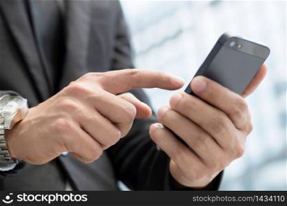 man is using a telephone to contact customers