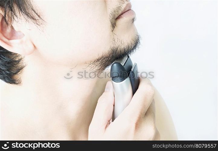 Man is using shaver