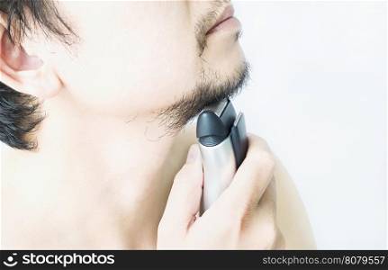 Man is using shaver