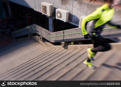 man jogging at cold autumn mornigng on steps