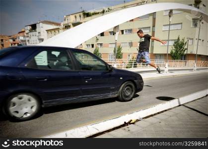 Man jumping infront of car