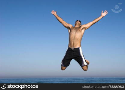 Man jumping on the beach