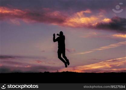                                man jumping over a pond with a sunset background