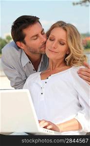 Man kissing a woman tenderly on the cheek