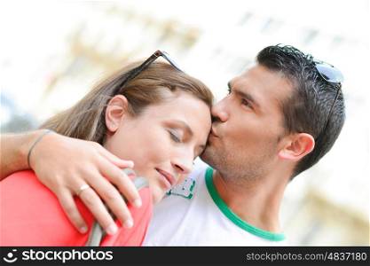 man kissing girl
