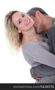Man kissing wife&rsquo;s neck