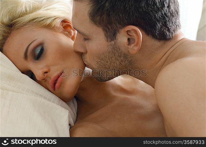 Man Kissing Woman&acute;s Face
