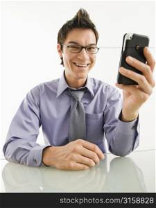 Man laughing at his phone