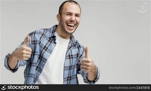 man laughing showing ok sign