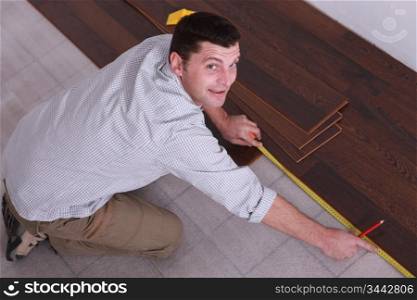 Man laying parquet floors
