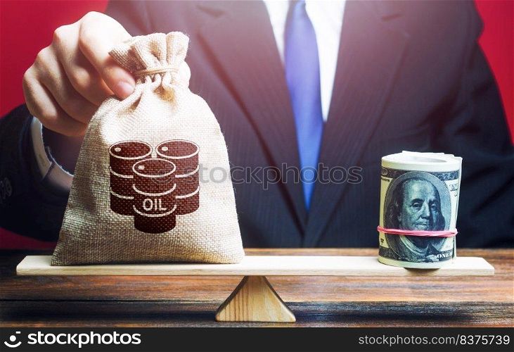 Man lays a bag with barrels of oil on his weight as opposed counterweight to dollars bundle roll. World pricing of oil. Cheap energy resources to restore economy. Market stabilization