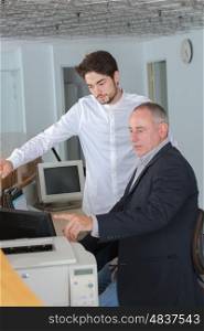 man learning to use a printer