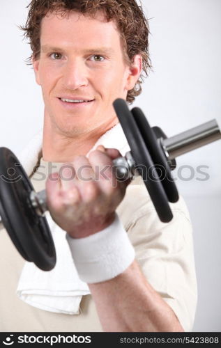 Man lifting dumbbell