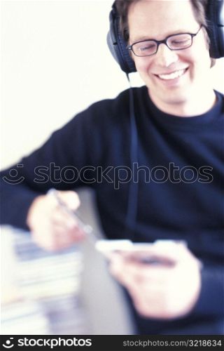 Man Listening to CDs