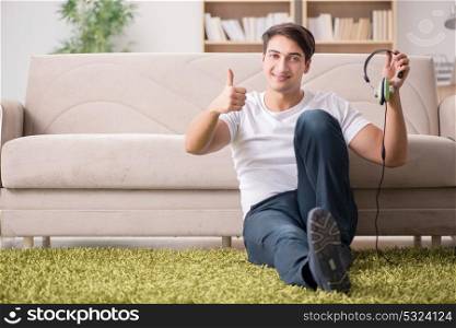 Man listening to music at home