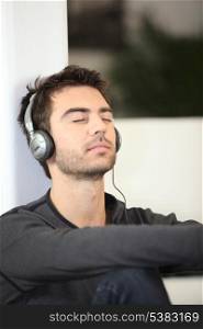 Man listening to music with eyes shut
