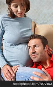 Man Listening to Pregnant Woman&acute;s Stomach