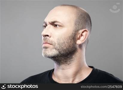 man look into the distance isolated on gray background