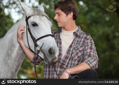 Man looking after horse