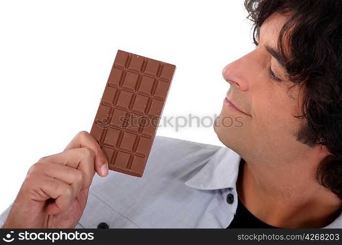 Man looking at chocolate bar