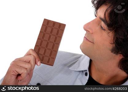 Man looking at chocolate bar