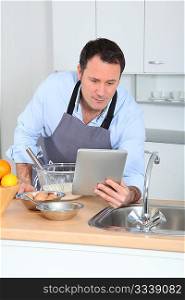 Man looking at recipe on internet