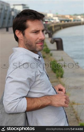 Man looking at river