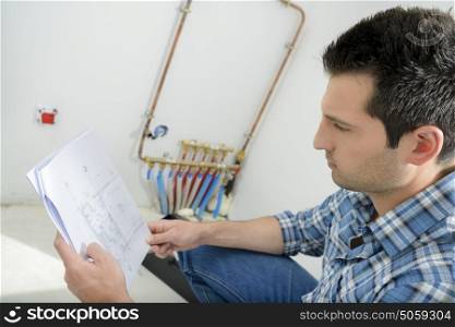 Man looking at wiring instructions