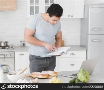 man looking from recipes online